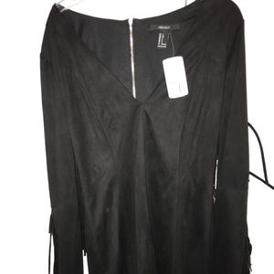 black dress with fringe sleeves